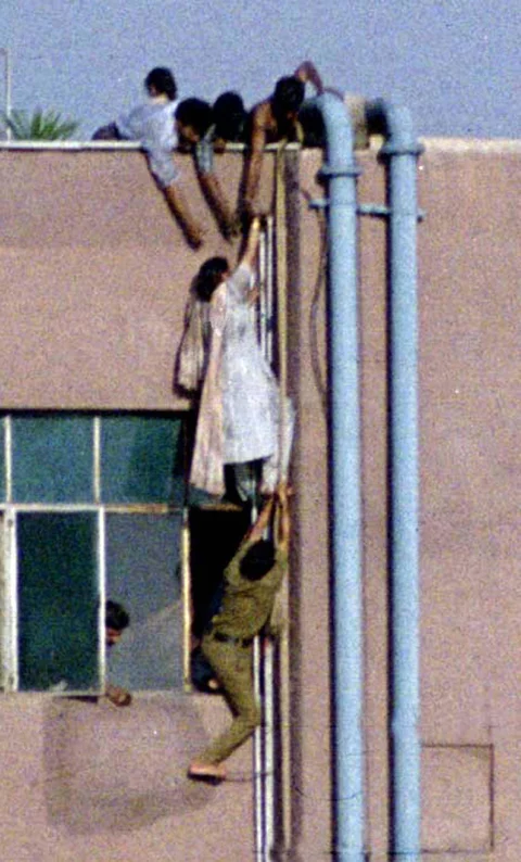 Escape from the Uphaar inferno. (Photo: Reuters)