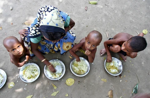 A Muslim women is feeding her children at a relief
camp in Assam in August 2012. (Photo: Reuters)