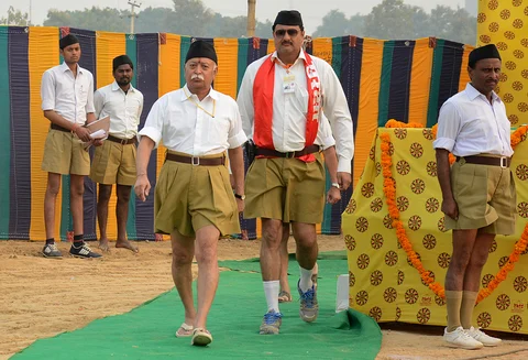 Mohan Bhagwat (3rd L), chief of Rashtriya Swayamsevak Sangh walks after addressing volunteers during a training camp in Agra in 2014. (Photo: Reuters)