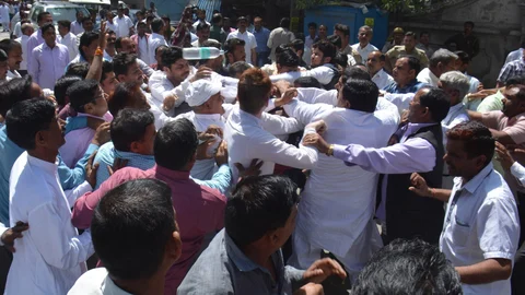 BJP and SP workers clash in Dali Bag of Lucknow during Sugarcane Committee elections, 22 March, 2016. (Photo: IANS)
