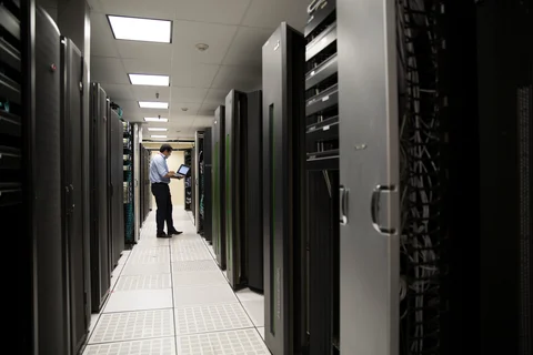 An engineer checks on cloud storage units in the data center at the Axtel San campus in Monterrey, Mexico (Photographer: Susana Gonzalez/Bloomberg)