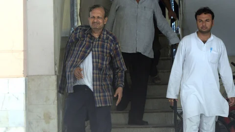 BK Bansal, senior official of the Ministry of Corporate Affairs who was arrested by CBI on bribery charges, comes out of his residence in New Delhi on 20 July 2016. (Photo: IANS)