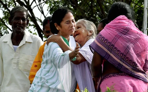 West Bengal Chief Minister Mamata Banerjee greeting villagers during a programme in Singur, West Bengal on Wednesday. (Photo: PTI)