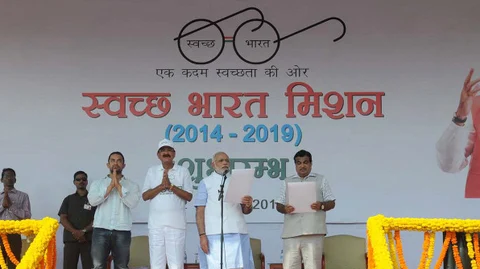 Prime Minister Narendra Modi (centre) at the launch of the Swacch Bharat (Clean India) Mission in New Delhi on October 2, 2014. <b>Image:</b> PIB
