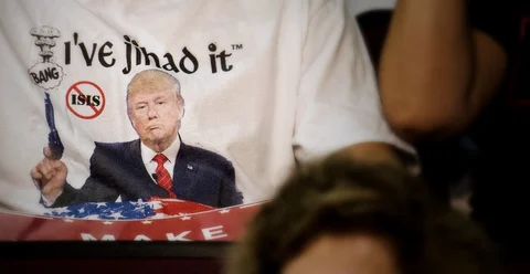 An attendee wears a shirt with the likeness of Donald Trump, 2016 Republican presidential nominee, during a campaign rally (Photographer: Ty Wright/Bloomberg) 
