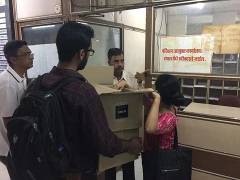 Uber employees deliver the first round of signed petitions to the Transport Commisioner’s office on Friday. (Photographer: Vishal Patel)