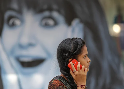 A woman talking on her mobile phone (Photographer: Dhiraj Singh/Bloomberg)