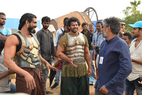 Baahubali actors Prabhas and Rana Daggubati discuss a scene with director S. S. Rajamouli. (Image source: Baahubali Facebook Page)