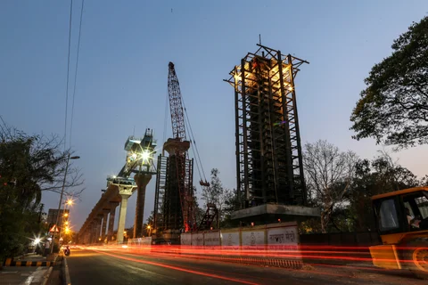 Construction of an elevated metro railway line in Nagpur. (Photographer: Dhiraj Singh/Bloomberg)