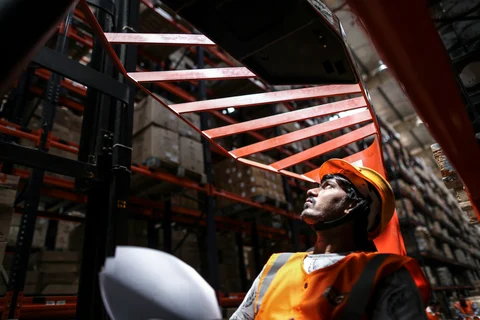 Forklift operator at the Future Group warehouse. (Photographer: Dhiraj Singh/Bloomberg)
