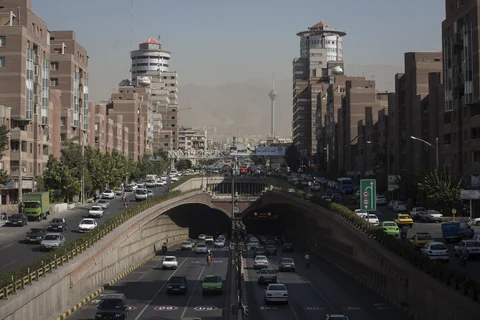 Road traffic fills a highway and underpass in present-day Tehran, Iran. (Photographer: Simon Dawson/Bloomberg)