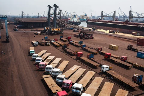 Trucks sit parked at the Haldia Dock Complex (HDC), part of the Kolkata Port Trust (KoPT), in Haldia, West Bengal, India. (Photographer: Sanjit Das/Bloomberg)