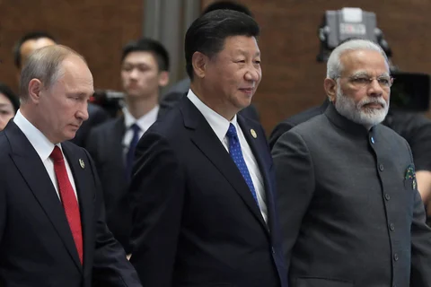 Vladimir Putin, Xi Jinping and Narendra Modi on the sideline of the BRICS Summit in Xiamen, China. (Photograph: PTI)