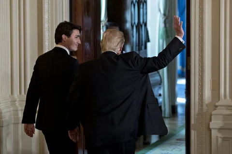 U.S. President Donald Trump, waves as he exits a news conference with Justin Trudeau, Canada’s prime minister, in the White House on February 13, 2017. (Photographer: Andrew Harrer/Bloomberg)