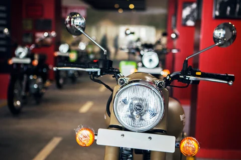 An Eicher Motors Ltd. Royal Enfield Desert Storm motorcycle stands on display at the company’s Royal Enfield flagship dealership in Gurgaon, India (Photographer: Prashanth Vishwanathan/Bloomberg) 