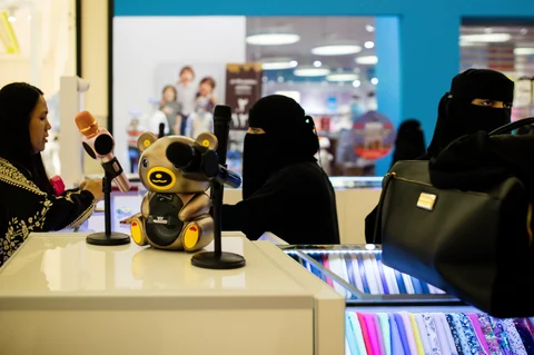 Saudi women sell products from a stall at the Al Yasmin mall in Jeddah, Saudi Arabia, on August 6, 2017. (Photographer: Tasneem Alsultan/Bloomberg)