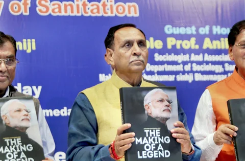 Gujarat Chief Minister Vijay Rupani releases a book on Prime Minister Narendra Modi in Ahmedabad on November 17, 2017. (Photograph: PTI)