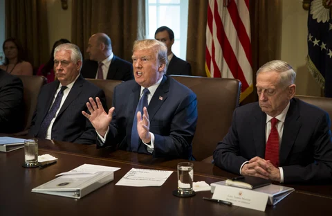 U.S. President Donald Trump, center, speaks while Rex Tillerson, U.S. Secretary of State, left, and Jim Mattis, U.S. Secretary of Defense, listen during a cabinet meeting in Washington, D.C., U.S., on November 1, 2017. (Photographer: Al Drago/Bloomberg)