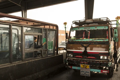 A truck stops at a toll booth at the Manesar toll plaza on National Highway 8 in Manesar, Haryana, India. (Photographer: Udit Kulshrestha/Bloomberg)