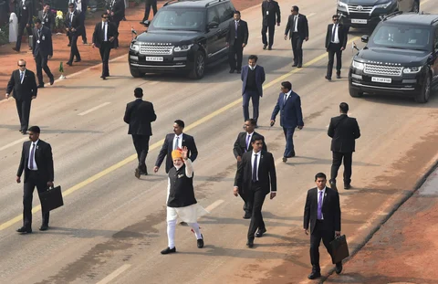 Prime Minister Narendra Modi waves at the crowd during the 69th Republic Day Parade at Rajpath. (Image: PTI)