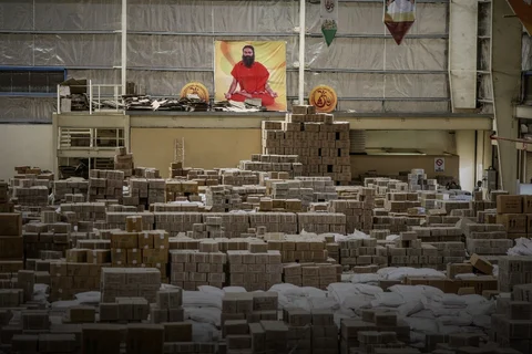 A poster depicting yoga guru Baba Ramdev is displayed inside a warehouse operated by Patanjali Ayurved Ltd. near to the Multi-modal International Cargo Hub Airport at Nagpur (MIHAN) in Nagpur. (Photographer: Dhiraj Singh/Bloomberg)