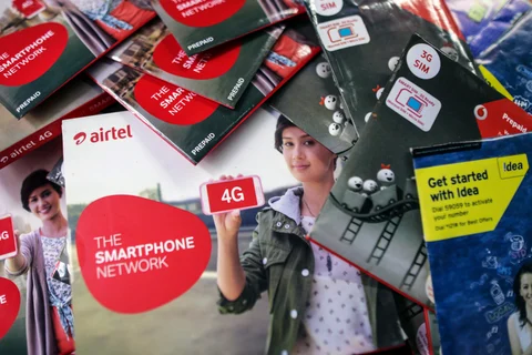 Bharti Airtel, Vodafone India. and Idea Cellular SIM card packs are arranged for a photograph in Mumbai, India. (Photographer: Dhiraj Singh/Bloomberg)