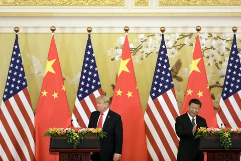 U.S. President Donald Trump, left, and Xi Jinping, China’s president, attend a news conference at the Great Hall of the People in Beijing, China, on Nov. 9, 2017. (Photographer: Qilai Shen/Bloomberg)