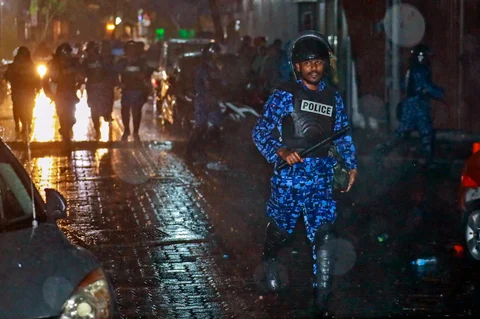 A Maldives policeman charges with baton towards protesters after the government declared a 15-day state of emergency in Male, Maldives, early on February 6, 2018. (Photograph: AP/PTI)