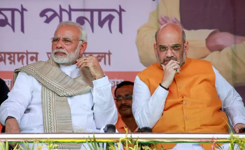Prime Minister Narendra Modi with BJP National President Amit Shah during the swearing-in ceremony of the newly elected ministers in Agartala on March 9, 2018. (Source: PTI)