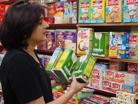 An Indian housewife shops for powdered milk at a New Delhi department store. (Photographer: Sondeep Shankar/Bloomberg News)