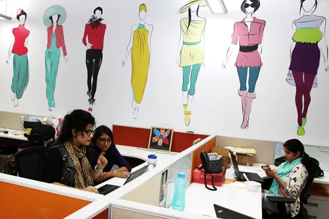Employees work at desks in the office of Myntra.com, a unit of Flipkart Internet Services Pvt., in Bangaluru. (Photographer: Namas Bhojani/Bloomberg)