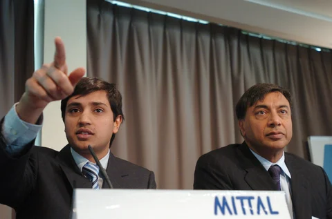 Aditya Mittal, left, and Lakshmi Mittal, chairman and chief executive of Arcelor Mittal in a file photograph. (Photographer: Antoine Antoniol/Bloomberg News)