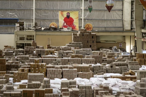 A poster depicting yoga guru Baba Ramdev is displayed inside a warehouse operated by Patanjali Ayurved Ltd. near to the Multi-modal International Cargo Hub Airport at Nagpur (MIHAN) in Nagpur. (Photographer: Dhiraj Singh/Bloomberg) 