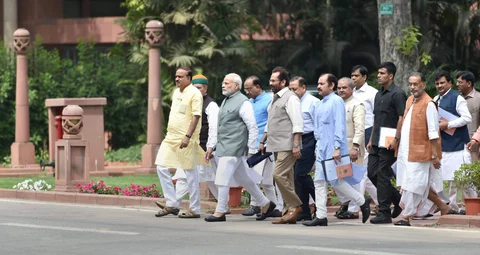 Prime Minister Narendra Modi along with Parliamentary Affairs Minister Ananth Kumar, Mukhtar Abbas Naqvi and other MPs leave after the BJP Parliamentary Party Meeting at the Parliament Library Building in New Delhi on April 6, 2018. (Photograph: PTI)