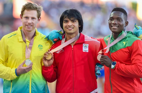 Gold medalist Neeraj Chopra with silver medalist Australia’s Hamish Peacock and bronze medalist Grenada’s Anderson Peters. (Source: PTI)