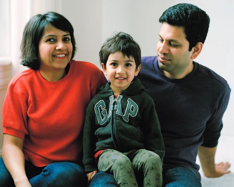 Deepa Chaudhary and Vikram Rangnekar with their younger son, Dhruv. (Photographer: Mark Sommerfeld/Bloomberg Businessweek)