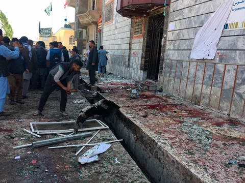 People gather outside a voter registration center, which was attacked by a suicide bomber in Kabul. (Source: PTI)