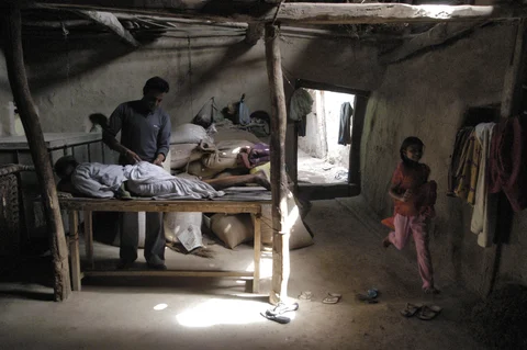 A rural doctor prepares to administer an injection to a patient in a small space in his house he has turned into a clinic in the village of Rajgarh, India. (Santosh Verma/Bloomberg News)