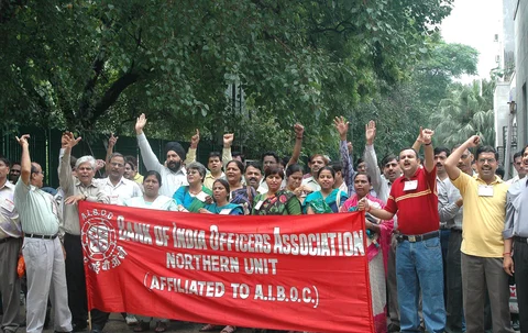 The reaction to talk of bank privatisation in the 2000s: Striking bank officers and employees shout slogans outside the main branch of the State Bank of India in New Delhi, on August 24, 2004. (Photographer: Sondeep Shankar/Bloomberg News)