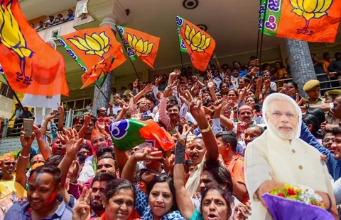 BJP workers celebrate the party’s lead in Karnataka Assembly Election 2018 outside the party office in Bengaluru on Tuesday. (Photographer: Shailendra Bhojak/PTI)