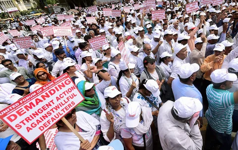 Bank employees hold a demonstration as part of their two-day nationwide strike to press for wage revision, in Ahmedabad. (Source: PTI)
