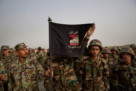 Afghan National Army soldiers from the 209th Corps stand for a review by commanding officers on their base in Mazar-i-Sharif, Afghanistan. (Photographer: Victor J. Blue/Bloomberg)