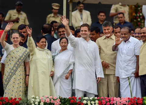 Newly sworn-in Karnataka Chief Minister H D Kumaraswamy, Andhra Pradesh CM N Chandrababu Naidu, AICC President Rahul Gandhi, West Bengal CM Mamata Banerjee, Bahujan Samaj Party (BSP) leader Mayawati and Congress leader Sonia Gandhi wave after the swearing-in ceremony, in Bengaluru, on Wednesday. (Photographer: Shailendra Bhojak/PTI)