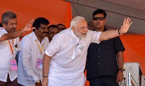 Prime Minister Narendra Modi waves at his supporters during an election campaign rally ahead of Karnataka Assembly Elections, at Chikmagalur in Karnataka, on May 9, 2018. (Photograph: PTI)