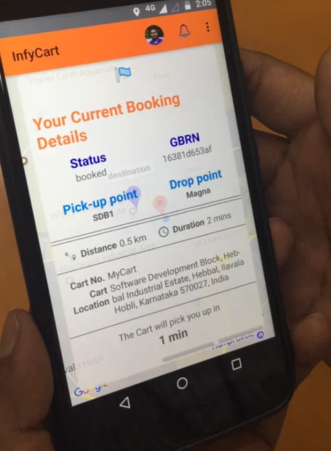 App developed by Infosys to book the cart in the campus. (Photographer: Nishant Sharma/BloombergQuint)