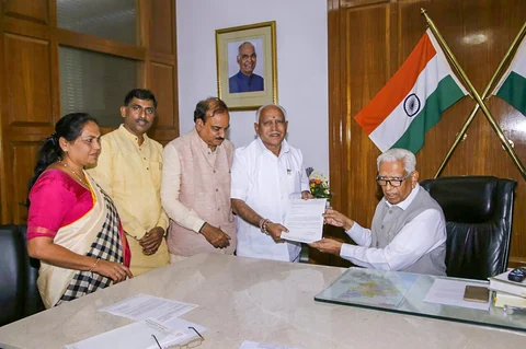 BJP’s chief ministerial candidate B S Yeddyurappa meets Karnataka Governor Vajubhai Vala after the Karnataka Assembly election 2018 results, in Bengaluru on May 15, 2018. (Photograph: PTI)