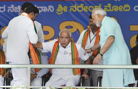 Prime Minister Narendra Modi with BJP’s chief ministerial candidate BS Yeddyurappa during Karnataka election campaign rally at Chamarajanagar. (Source: PTI)