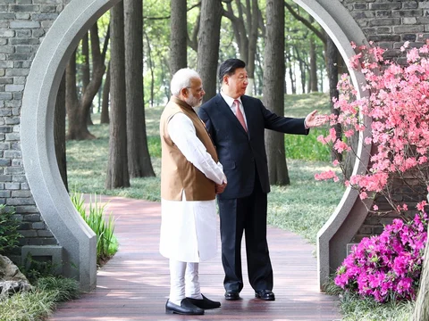 Prime Minister Narendra Modi, left, and Chinese President Xi Jinping talk at a garden in Wuhan in central China’s Hubei Province, on April 28, 2018. (Photograph: Xinhua/AP/PTI) 