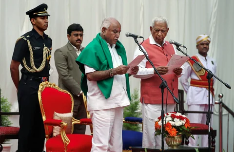 Karnataka Governor Vajubhai Vala administers oath to Bharatiya Janata Party (BJP) leader B S Yeddyurappa as Chief Minister of the state at a ceremony in Bengaluru. (Source: PTI)
