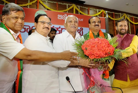 Union ministers and BJP leaders Prakash Javadekar, Ananth Kumar and JP Nadda greet Karnataka unit chief of the party B S Yeddyurappa, after he was elected leader of the BJP legislature party, in Bengaluru. (Source PTI)